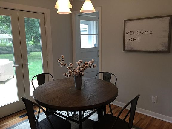 Enjoy eating your meals in this dining room with french door