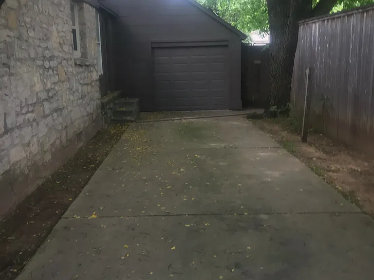Side of the home leading to the single-car garage