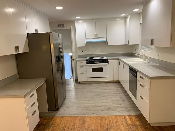 Freshly painted kitchen cabinets and new hardware
