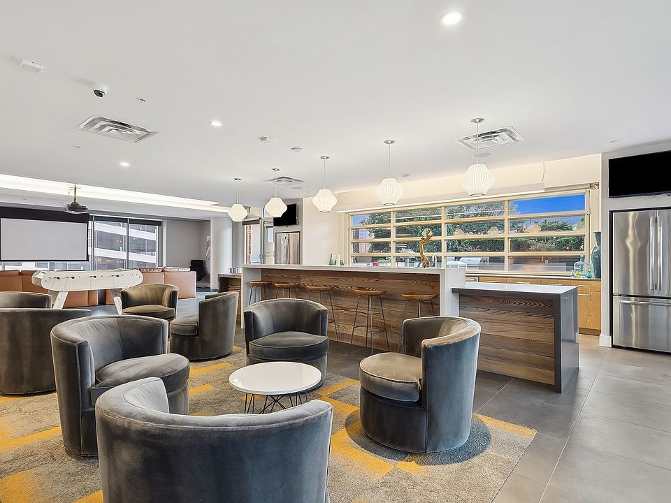 Clubroom with bar, theater, and gaming area