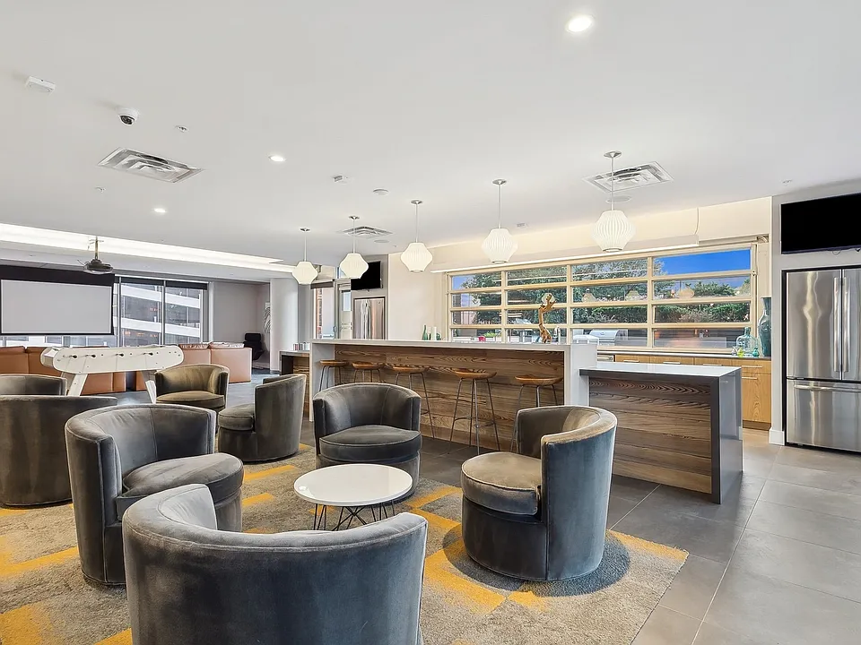 Clubroom with bar, theater, and gaming area