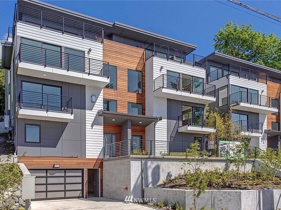 Built in 2020 in West Queen Anne, this contemporary townhome offers four levels of living space and Secure garage.