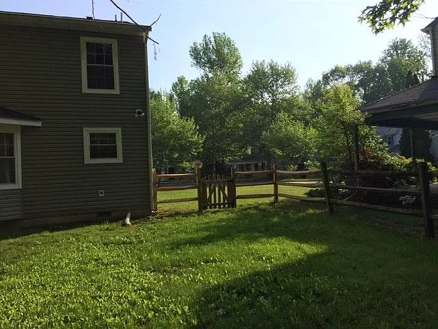The Backyard fenced with gates on both sides of the yard. - 6555 Lion Ct