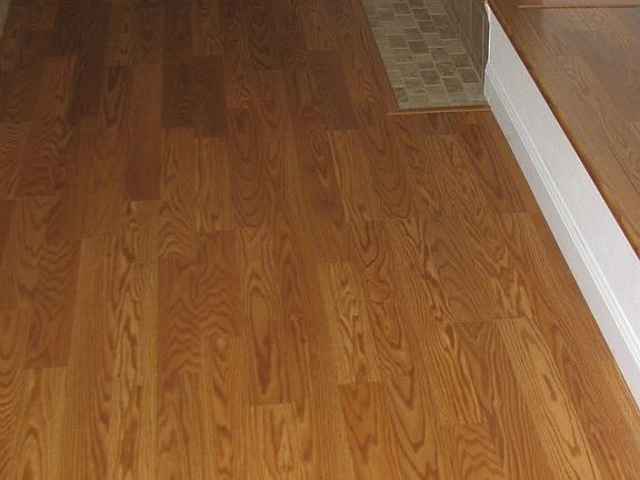 Walkway in Family room (from entry to Kitchen) - High quality Wood Laminate