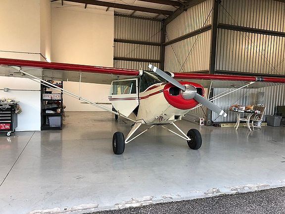 Hanger with clamshell door