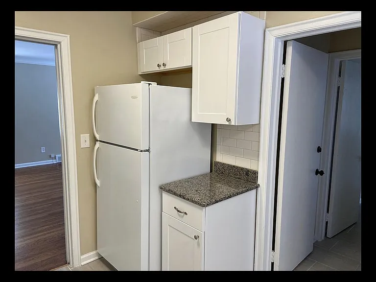 Kitchen and side entrance to the unit