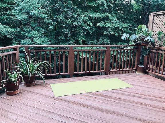 Large main deck backed to woods