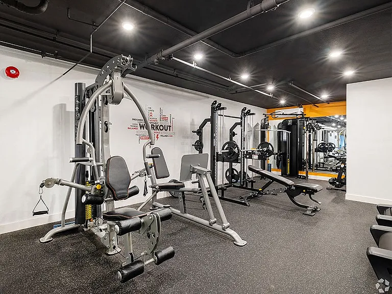 On-site fitness center with treadmills and weight machines.