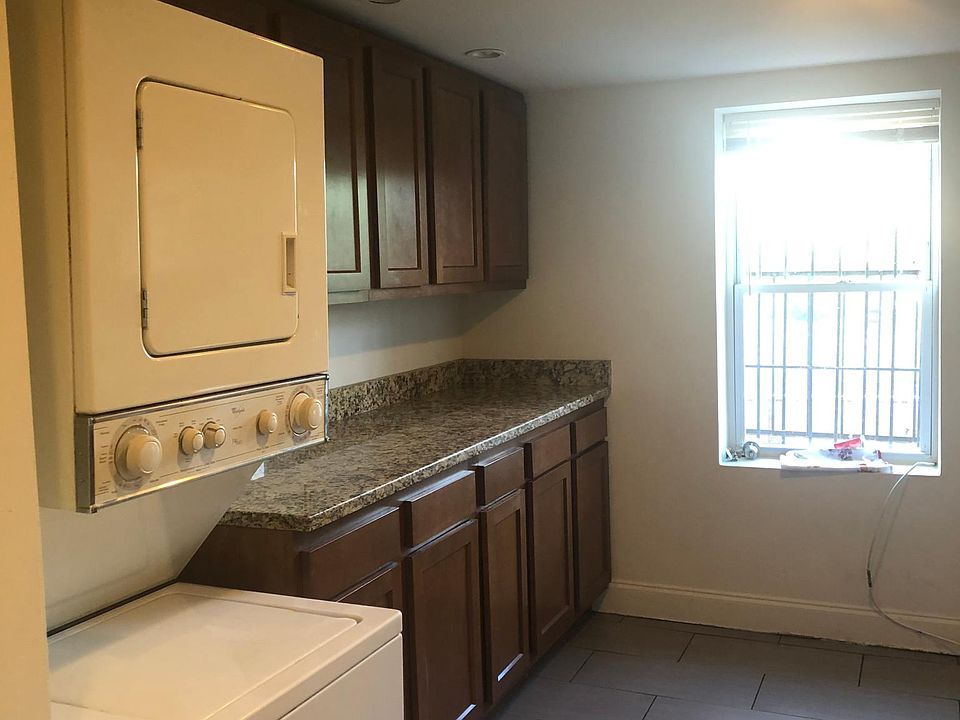 Kitchen with washer and dryer