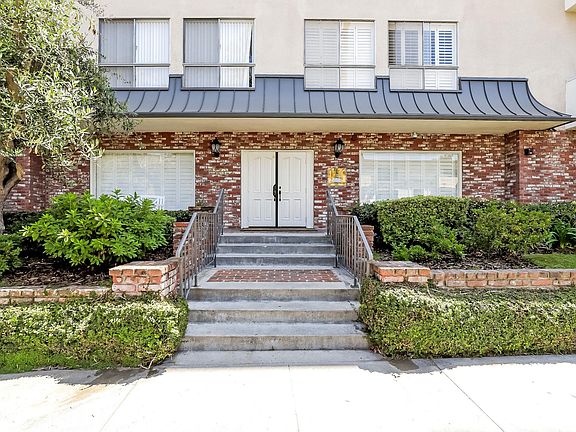 Front Entry- Pictured: Street View of the Beautifully Landscaped Secure Front Entry w/ Access Control Call Box