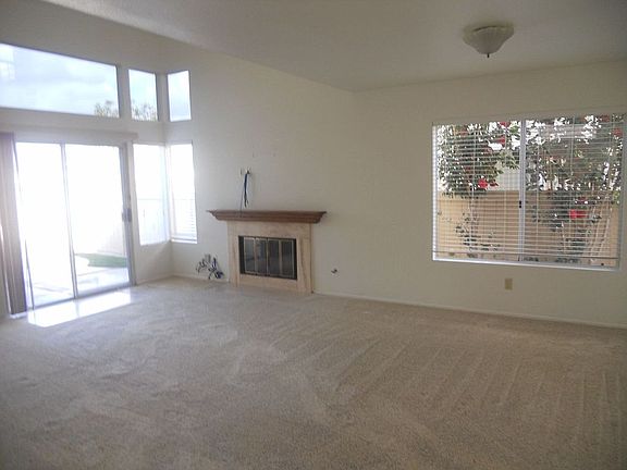 Living room with Vaulted ceilings, fireplace and lots of lig