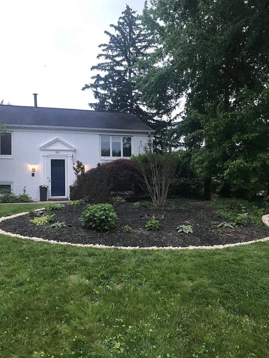 Landscaped garden in front of main entrance. - 6919 Southridge Dr