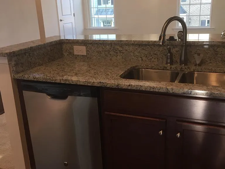 double kitchen sink overlooking formal Living area
