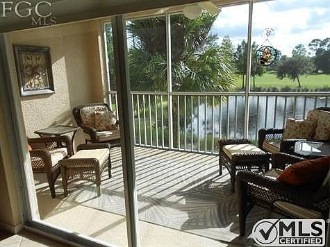 View from back screened lanai which over looks a lake and golf course.