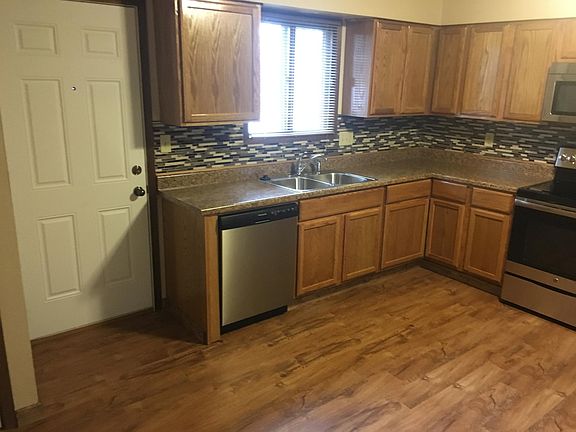 Exterior entrance as well as hallway entrance in living room.