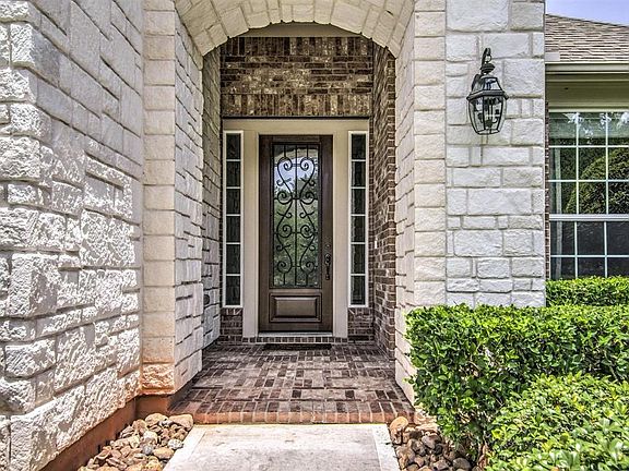 Gorgeous Brick Stone Elevation with Iron Accent Entrance