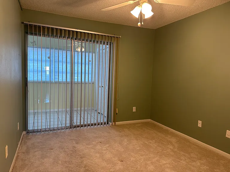 Bedroom 2 W/ sliders to Florida room