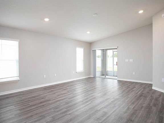 And, the living area opens to your screened lanai - New home for sale in Auburndale, FL