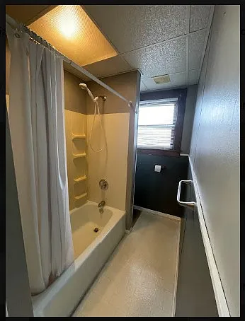 Shower. Privacy toilet is located in the nook behind shower