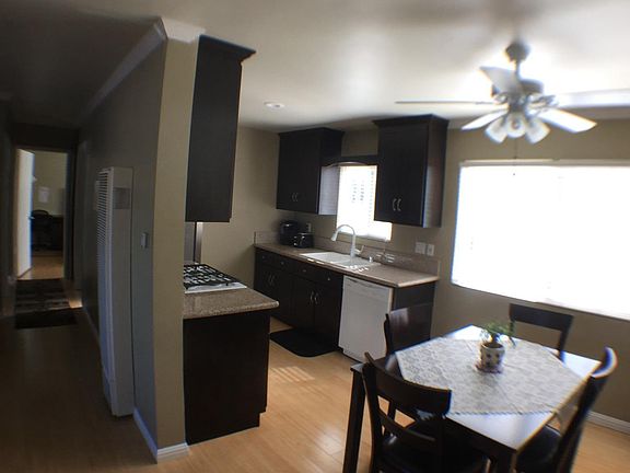 Fully appointed kitchen and bright dining area including ref