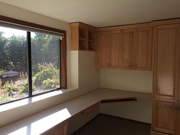 Master bedroom with built-in bed and cabinets