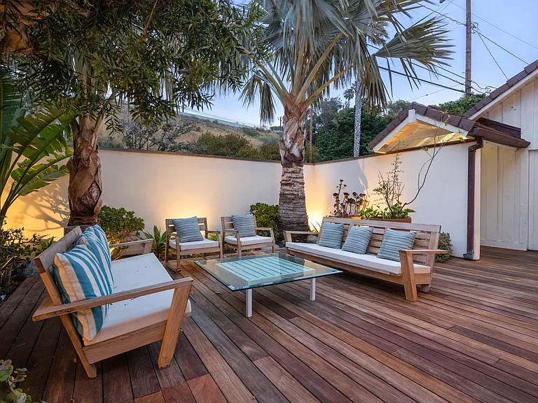 Gather in the outdoor space for coffee and good times!
As the sun sets, lounge in the outdoor space and cheers to a wonderful vacation!