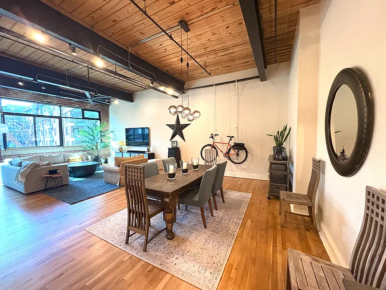 spacious dining area with solid mahogany farmstead table