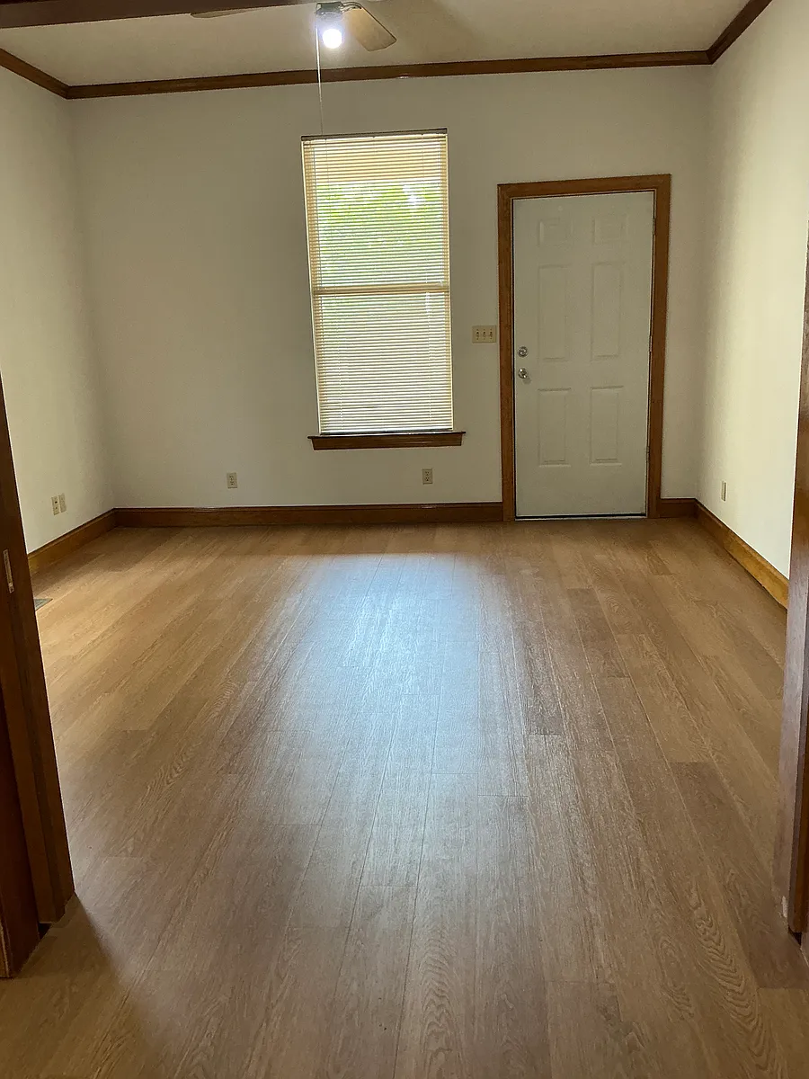 Living room with new floors - 15 S Tucker St