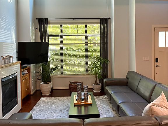 Large living area with an open loft and lots of natural light