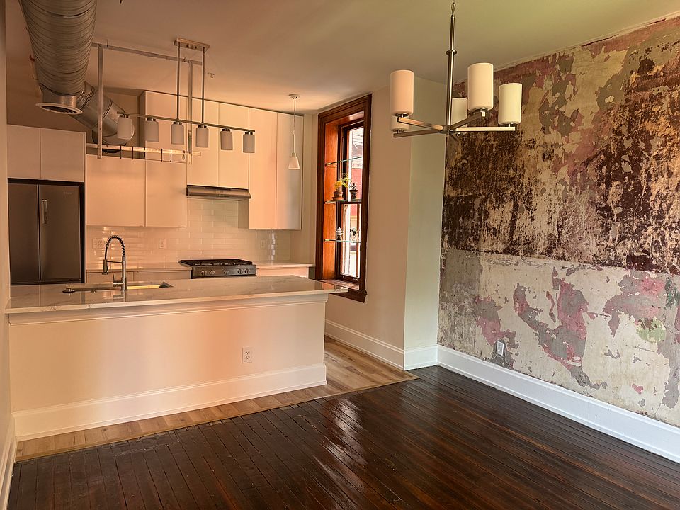 Kitchen and dining room showcasing paint colors from years past plus original signatures of artisans
