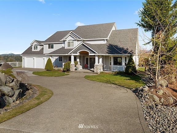 This home boast over 4700 sq ft of fabulous living - inside & out! Large pasture to the lower left side of the house. Not featured in this photo- there is a pond located on this lot that used to be stocked with trout.