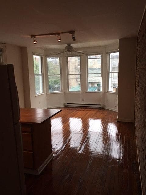 open living area w/ hardwood woods
