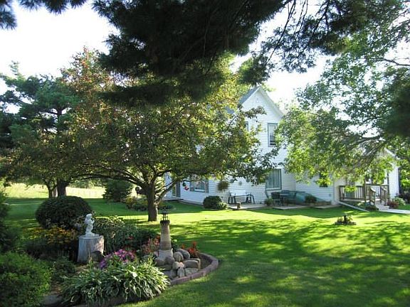 Gorgeous landscaping and a huge yard surround this fine home.