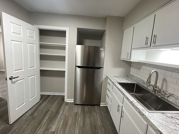 The kitchen has a large in-kitchen pantry.