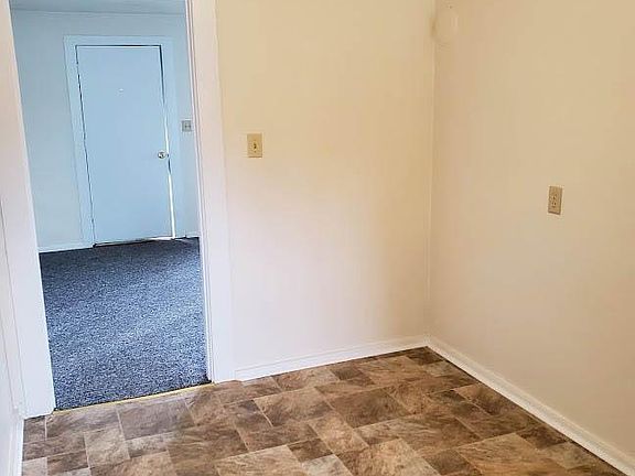 Space for table in kitchen. Looking toward front door.