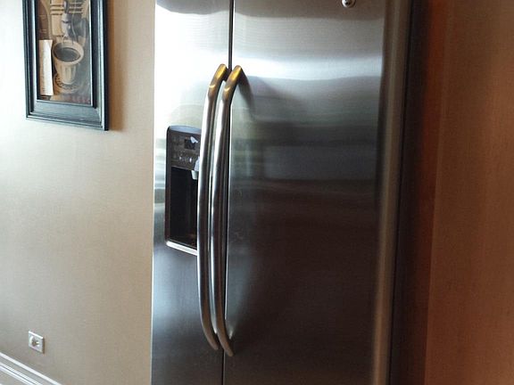 Stainless steel refrigerator with water and ice dispenser