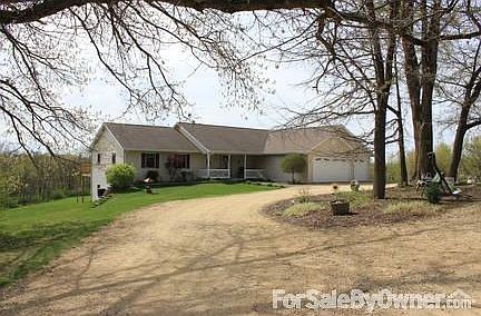 FRONT VIEW OF HOME WITH 3-CAR ATTACHED GARAGE