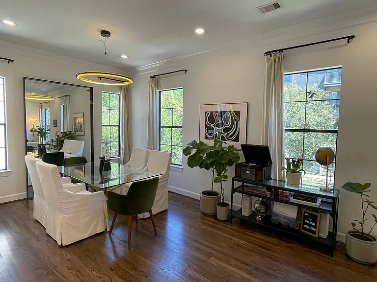Open Dining Area with high ceilings and lots of natural light!