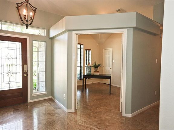 Beautiful Leaded Glass Front Door Welcomes Guests. Double Door Entry into the Study