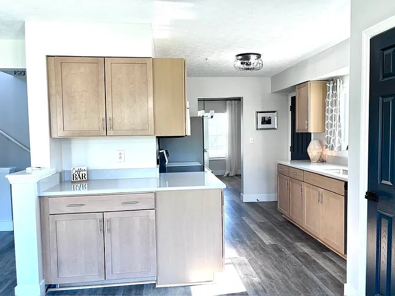 Coffee or wine bar, adjacent to dining area and open to living area