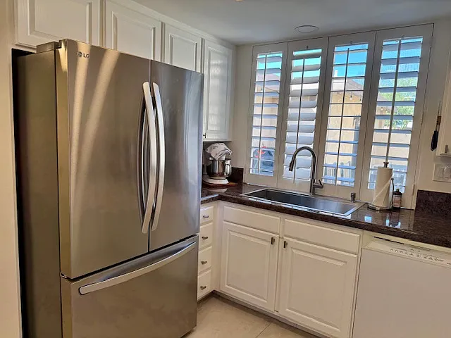 Kitchen with window out to front courtyard.