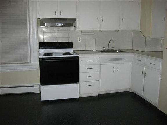 Outsied the kitchen is a small privte yard surrounded by pri