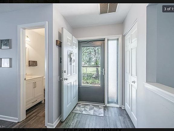 View from the Entrance with a easy to access half bath on the side for guests. Upgraded Floors throughout the home.