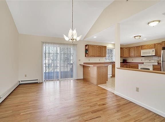 The living room opens to spacious formal dining room.