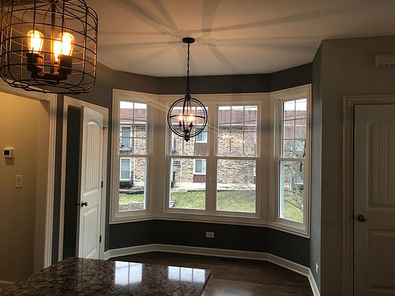 Sunny bay windows with custom moulding