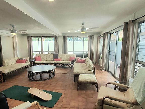 Spacious living room with adjacent laundry facilities and 3/4 bathroom - NEW split AC unit will be installed mid-October