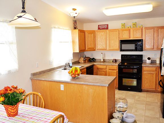 Open kitchen design with breakfast nook.