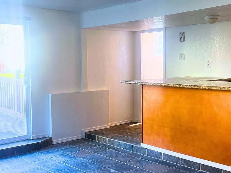 Downstairs living area with access to large backyard deck