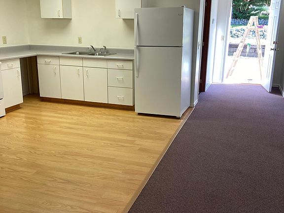Kitchen: Refrigerator and stove new with hardwood flooring