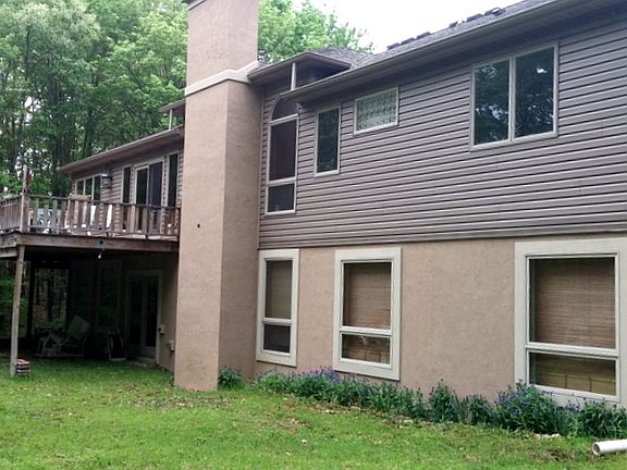 Back of home with basement 